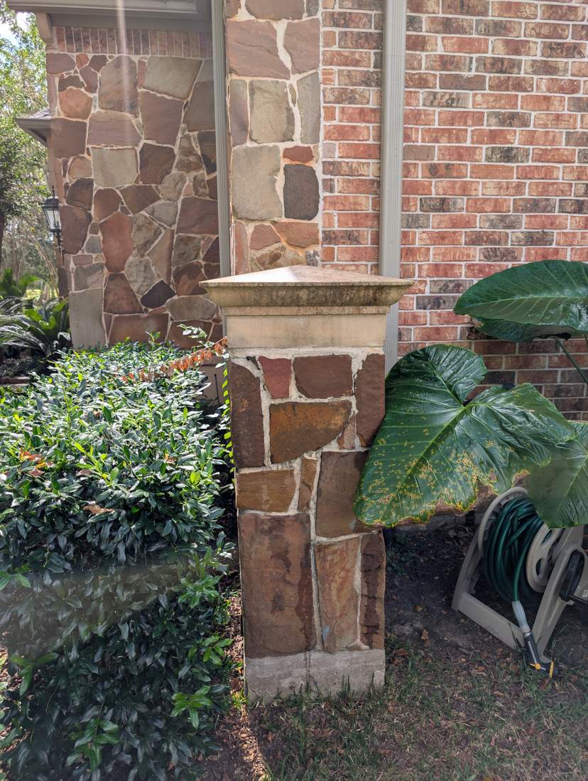 Stone pillar cap before softwashing