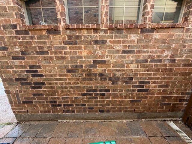 Brick wall after softwashing with staining removed